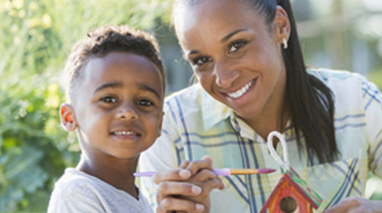 mother and son making crafts